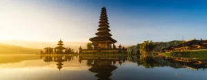 Pura Ulun Danu Bratan Temple reflecting on Lake Bratan at sunrise—a romantic Bali destination for couples